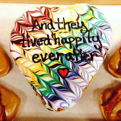 Heart Shaped iceed doughnut iced with the words And they lived happily ever after.
